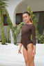 Two-piece dark brown swim set by Adaya featuring modest design and flowing real wrap skirt