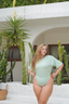 Lichen Mona swim set featuring Ana wrap skirt, stylish modest beachwear for women seeking coverage