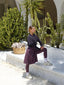 Women’s modest athletic skirt in plum tone offering comfortable and covered sportswear for daily activity.

