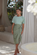 Modest swimwear set with shiny Lichen/Sage one-piece and lightweight Sage Elina 2.0 wrap-style skirt for full coverage.