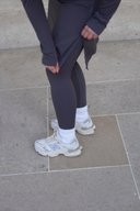 Stylish 20-inch modest activewear skirt in charcoal, combining functionality and elegance.